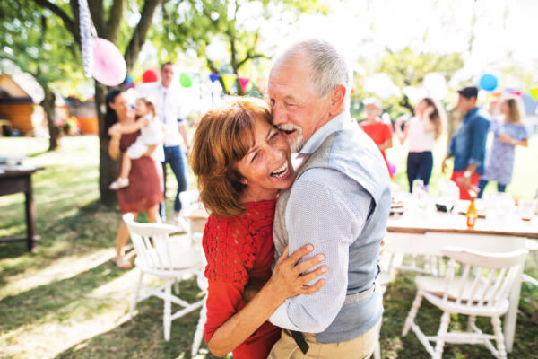 Happy older couple dancing at a party